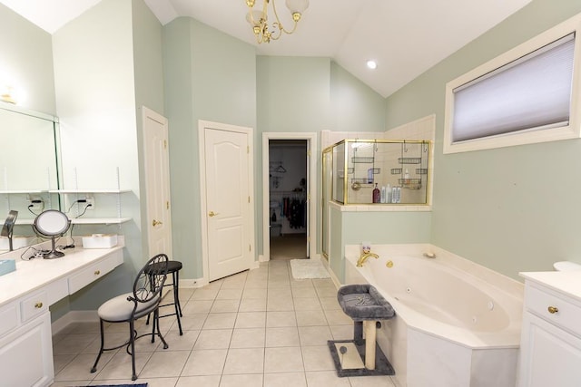 bathroom with tile patterned flooring, a notable chandelier, vaulted ceiling, a tub with jets, and a stall shower