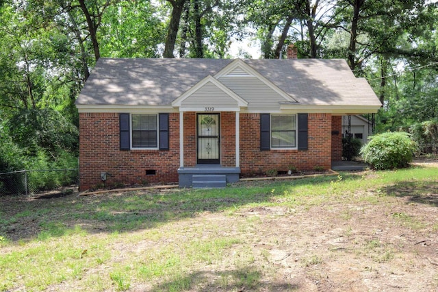 view of front of home featuring crawl space, brick siding, fence, and a chimney