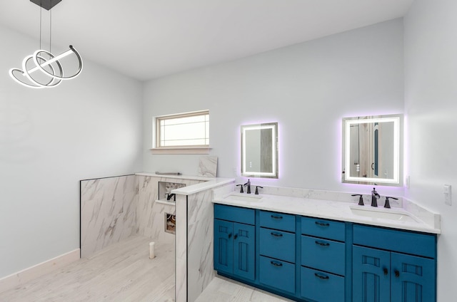 full bathroom featuring double vanity and a sink