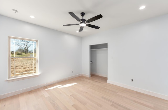 unfurnished bedroom featuring light wood finished floors, recessed lighting, a closet, ceiling fan, and baseboards