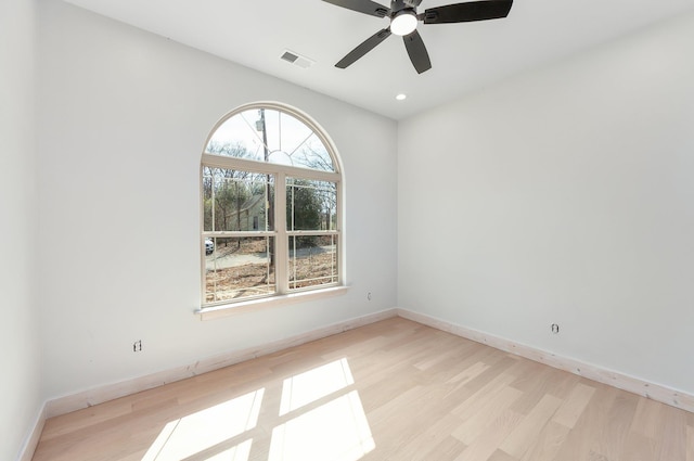 unfurnished room with baseboards, visible vents, a ceiling fan, light wood-type flooring, and recessed lighting