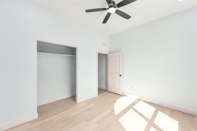 unfurnished bedroom with visible vents, baseboards, a ceiling fan, light wood-style flooring, and a closet