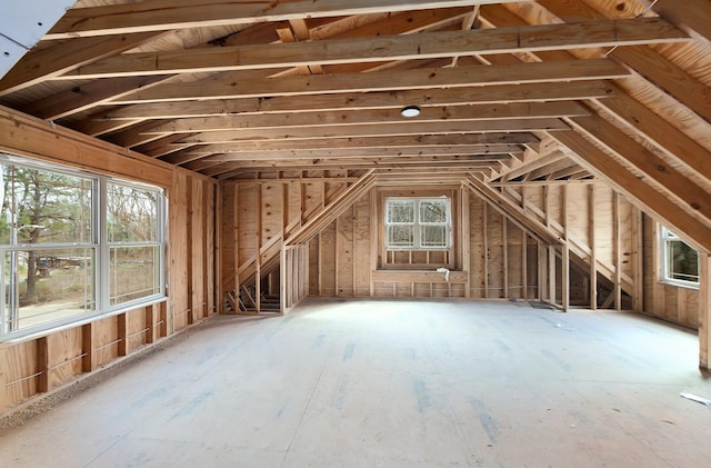 attic featuring a healthy amount of sunlight