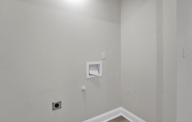 laundry room featuring hookup for a gas dryer, electric dryer hookup, wood finished floors, laundry area, and baseboards