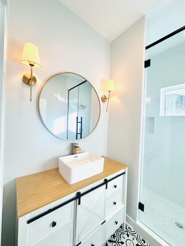 full bathroom featuring a stall shower and vanity