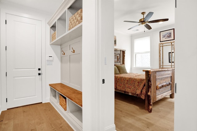 mudroom featuring light wood finished floors and a ceiling fan