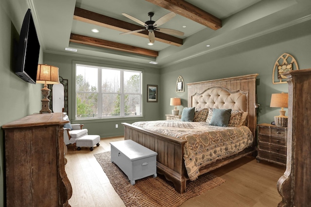 bedroom featuring ceiling fan, beamed ceiling, light wood-type flooring, and recessed lighting