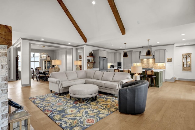 living area featuring high vaulted ceiling, recessed lighting, baseboards, light wood-style floors, and beam ceiling