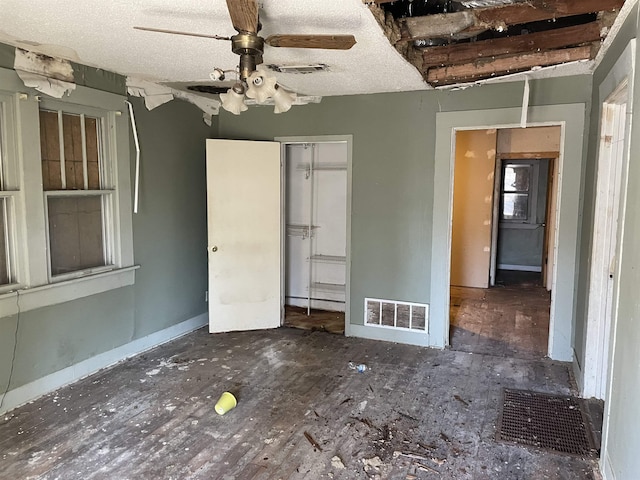 unfurnished bedroom featuring a closet, visible vents, and a textured ceiling