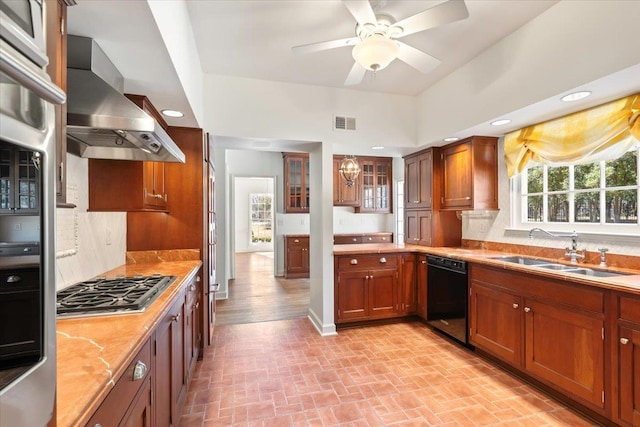 kitchen featuring black dishwasher, stainless steel gas cooktop, visible vents, a sink, and wall chimney exhaust hood