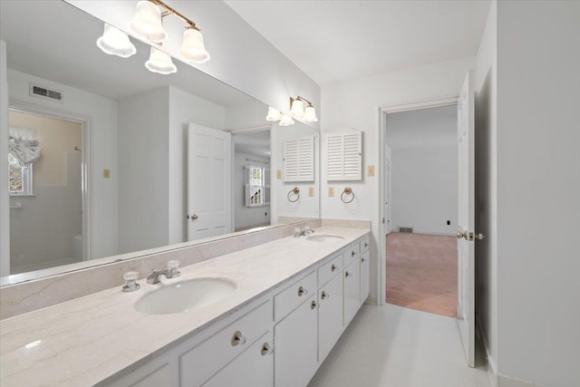 full bath featuring visible vents, a sink, and double vanity