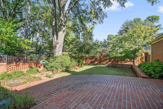 view of patio / terrace featuring fence