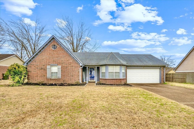 single story home with brick siding, fence, a garage, driveway, and a front lawn