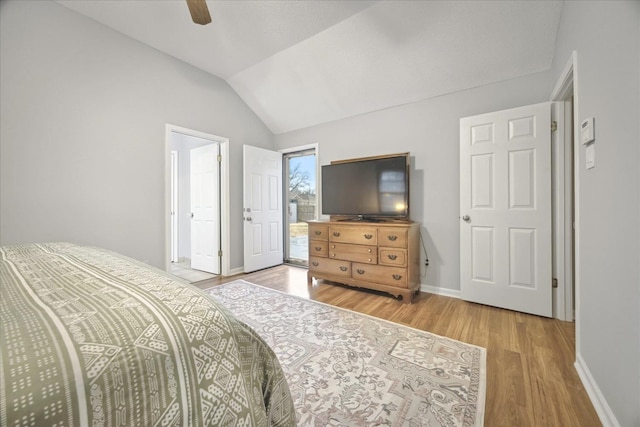 bedroom featuring vaulted ceiling, wood finished floors, a ceiling fan, and baseboards