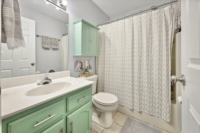 bathroom featuring toilet, tile patterned floors, shower / bath combo with shower curtain, a textured ceiling, and vanity