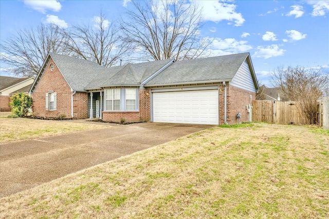 view of front of house featuring brick siding, concrete driveway, a front yard, fence, and a garage