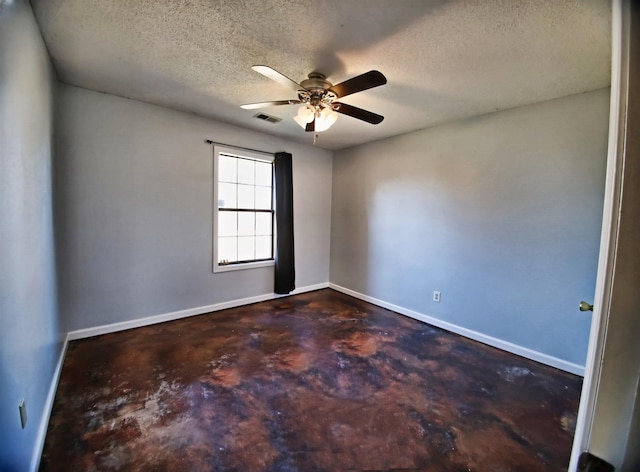 empty room featuring visible vents, a textured ceiling, concrete floors, baseboards, and ceiling fan