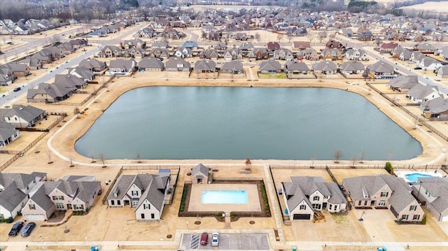 aerial view featuring a water view and a residential view