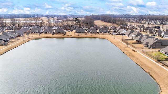 birds eye view of property featuring a water view and a residential view