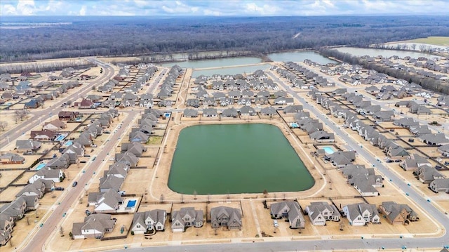 drone / aerial view featuring a residential view and a water view