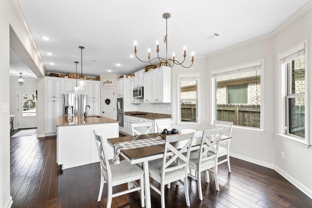 dining room with baseboards, visible vents, dark wood-style floors, ornamental molding, and recessed lighting