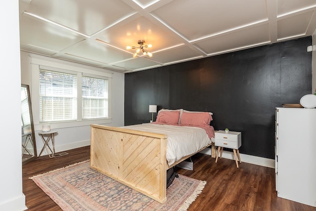 bedroom featuring baseboards, coffered ceiling, and dark wood-type flooring