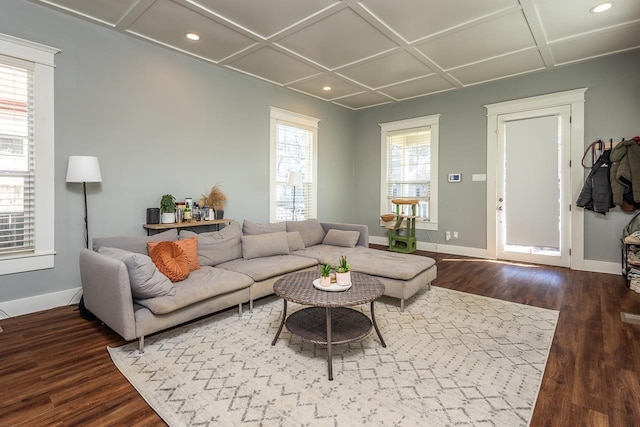 living area with coffered ceiling, wood finished floors, and baseboards