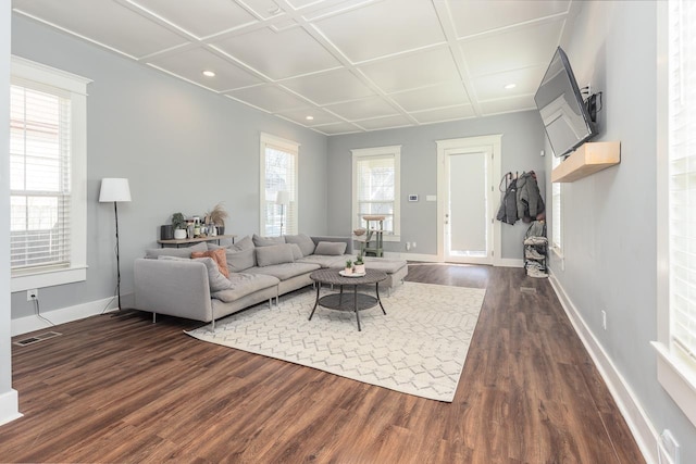 living room with dark wood-style flooring, coffered ceiling, and baseboards