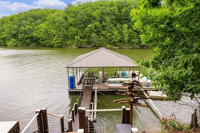 dock area with a water view and boat lift