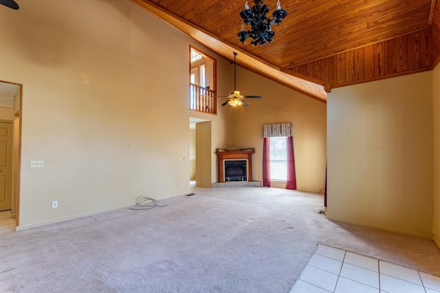 unfurnished living room with a fireplace with raised hearth, high vaulted ceiling, wooden ceiling, light carpet, and a ceiling fan