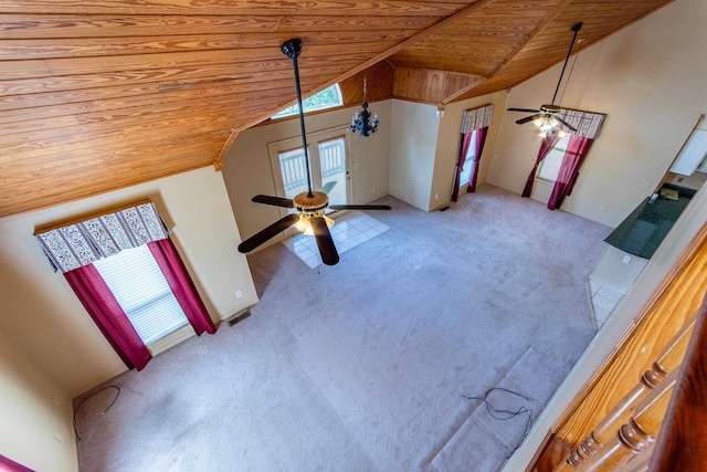 interior space featuring vaulted ceiling, carpet floors, wooden ceiling, and a ceiling fan