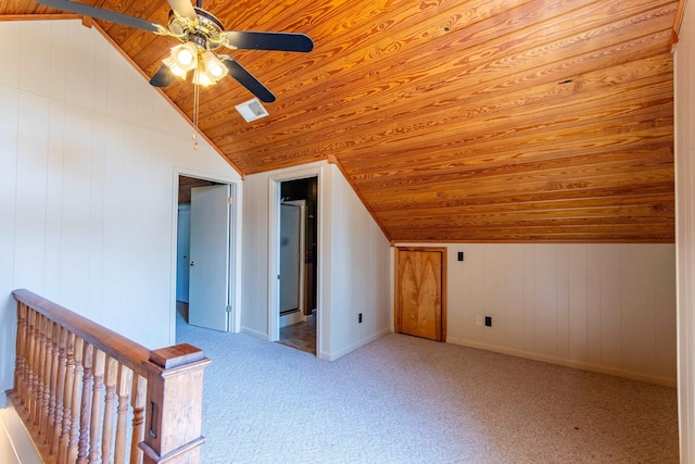 bonus room featuring baseboards, light colored carpet, wooden ceiling, ceiling fan, and vaulted ceiling