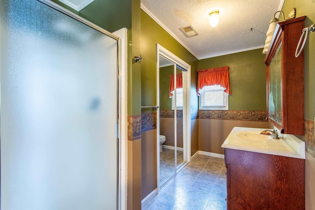 full bathroom featuring visible vents, toilet, a stall shower, a textured ceiling, and vanity