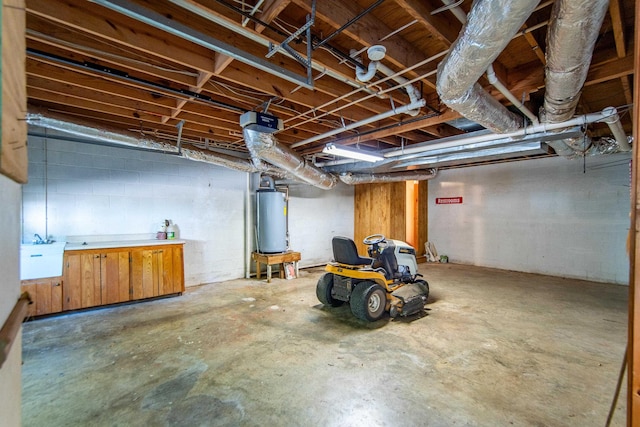 unfinished basement with gas water heater and a sink