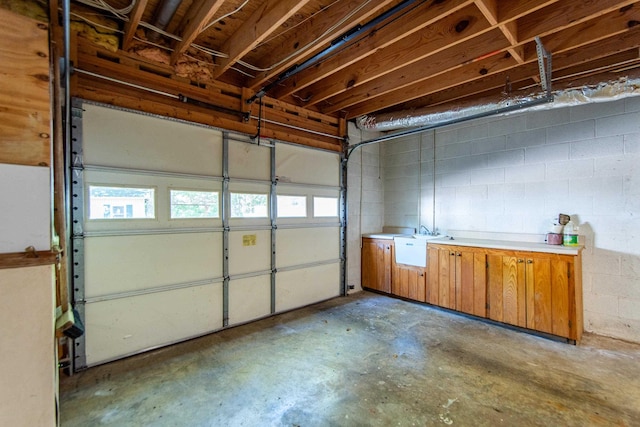 garage with concrete block wall