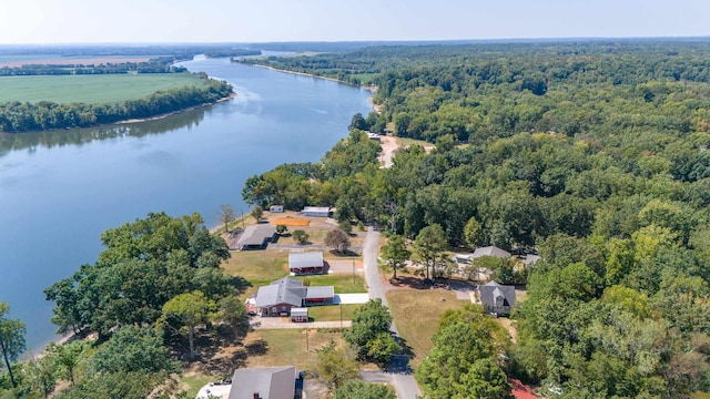 aerial view with a water view and a forest view