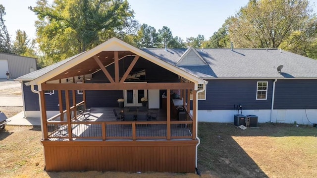 back of house featuring crawl space, a shingled roof, cooling unit, and a gazebo