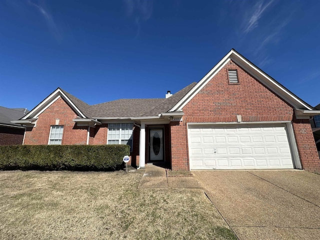 single story home featuring a garage, driveway, a front yard, and brick siding