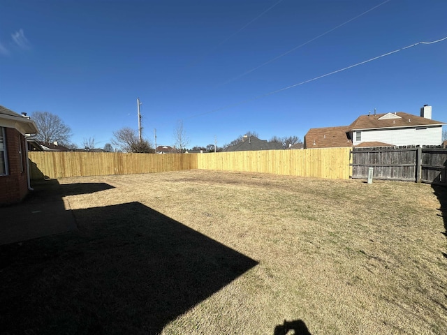 view of yard with a fenced backyard