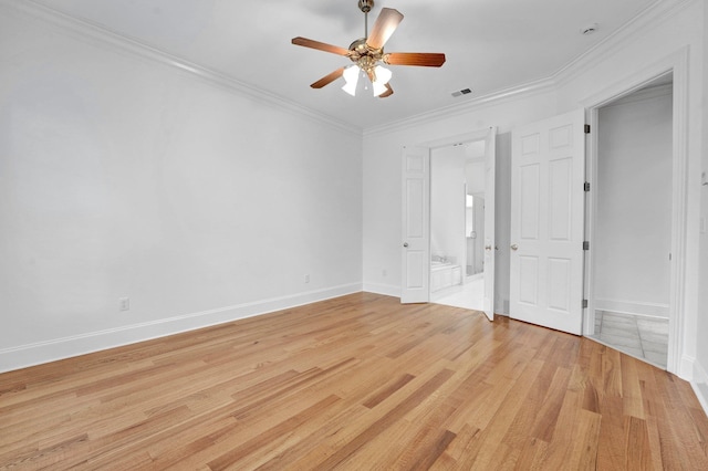 unfurnished bedroom with visible vents, crown molding, light wood-style flooring, and baseboards