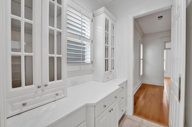 interior space featuring light tile patterned floors and visible vents