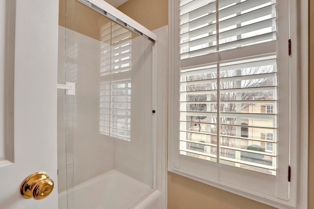 full bathroom with shower / bath combination with glass door