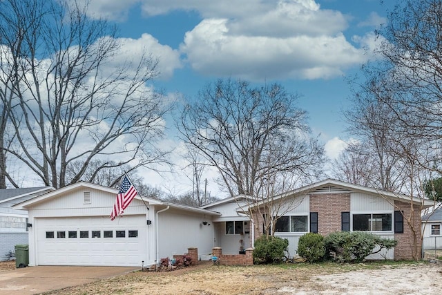 ranch-style house featuring driveway, brick siding, and an attached garage