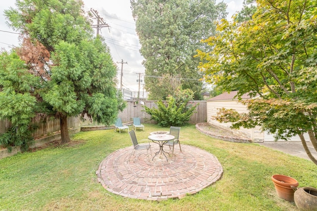 view of yard with a fenced backyard and a patio