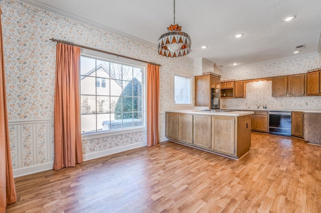 kitchen featuring black appliances, ornamental molding, light countertops, and wallpapered walls