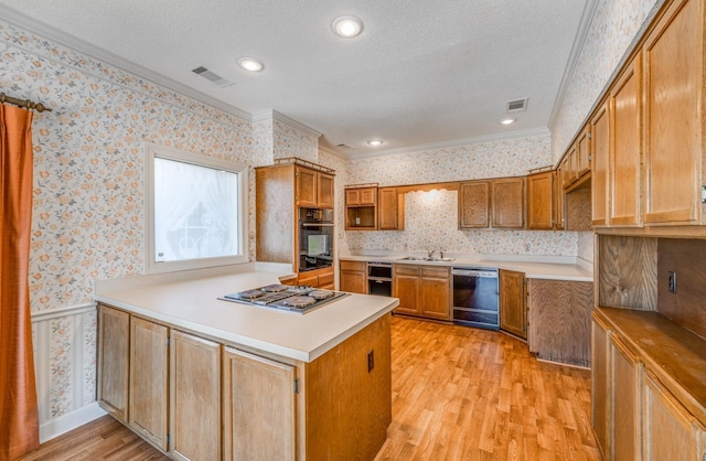 kitchen featuring wallpapered walls, visible vents, dishwashing machine, a peninsula, and stainless steel electric stovetop