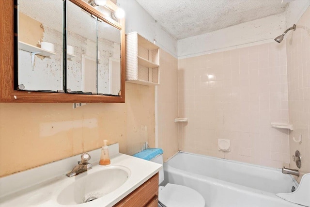 full bathroom with a textured ceiling, toilet, washtub / shower combination, and vanity