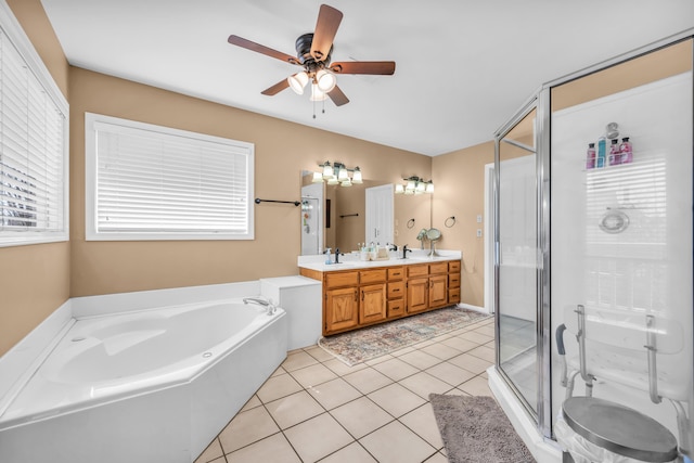 bathroom featuring a wealth of natural light, a shower stall, tile patterned flooring, and a bath