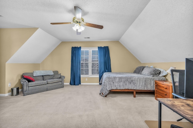 bedroom with a textured ceiling, a ceiling fan, visible vents, baseboards, and carpet