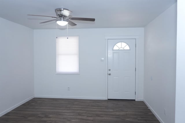 entrance foyer with ceiling fan, baseboards, and dark wood-type flooring